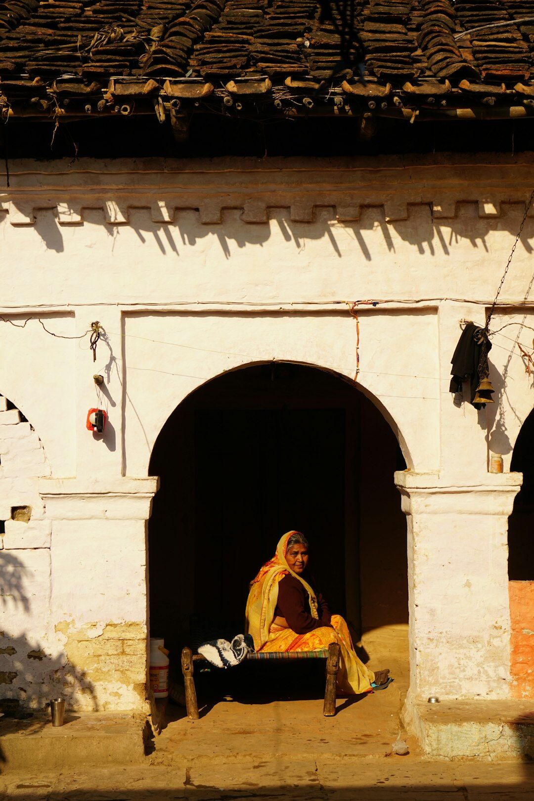 elderly woman telling story in village